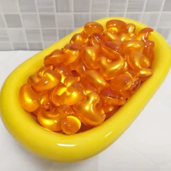 Bolsa Regalo 12 Perlas De Baño Aroma Vainilla - Con Aceite De Soja - Hidrata, Suaviza Y Perfuma La Piel - Forma Pato